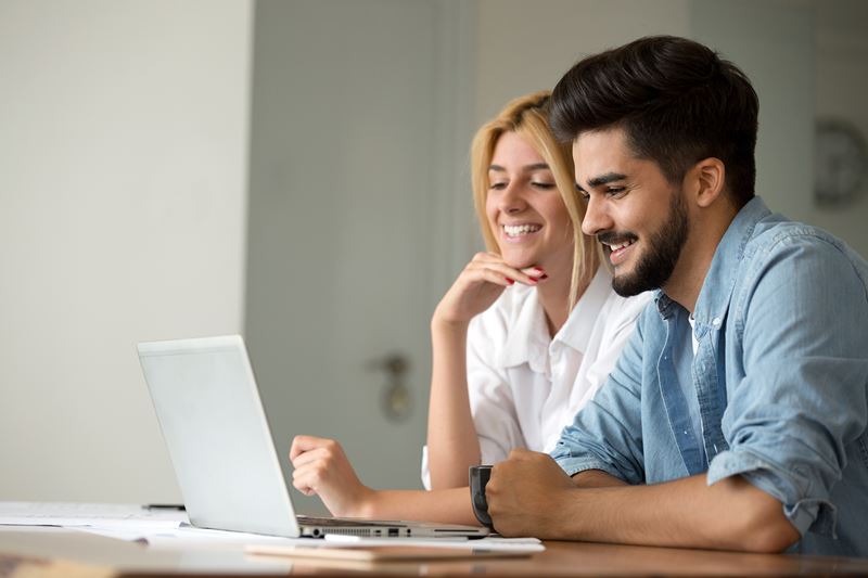 two people working on a computer